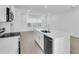 The kitchen features stainless steel appliances, stone countertops and a center island at 17326 Alderwood Ln, Punta Gorda, FL 33982