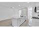 The kitchen features a center island and stainless steel appliances at 17326 Alderwood Ln, Punta Gorda, FL 33982