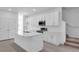 The kitchen features white cabinets, stainless steel appliances, and center island at 17326 Alderwood Ln, Punta Gorda, FL 33982