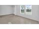 Inviting living room with tiled floor and natural light showcases a welcoming atmosphere at 17326 Alderwood Ln, Punta Gorda, FL 33982