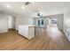 Spacious living area with hardwood floors, and access to patio at 1427 E Gate Dr, Venice, FL 34285