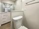Simple bathroom with toilet and a white vanity at 1427 E Gate Dr, Venice, FL 34285