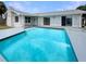 Inviting swimming pool in the backyard of a single-Gathering home at 1427 E Gate Dr, Venice, FL 34285