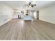 Open concept kitchen and living area with light wood flooring at 1427 E Gate Dr, Venice, FL 34285