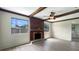 Living room with exposed beams, fireplace and hardwood floors at 1427 E Gate Dr, Venice, FL 34285