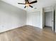Spacious bedroom featuring light wood flooring and a large closet at 1427 E Gate Dr, Venice, FL 34285