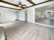 Bright living room with hardwood floors and exposed beams at 1427 E Gate Dr, Venice, FL 34285