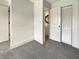 Bedroom with grey carpet and an ensuite bathroom at 1427 E Gate Dr, Venice, FL 34285