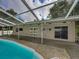 Inviting screened pool area with patio and access to the house at 11805 Carmen Ave, Dade City, FL 33525