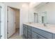 Modern bathroom with gray vanity, quartz countertop, and walk-in shower at 17347 Peregrine Way, Punta Gorda, FL 33982