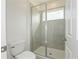 Clean bathroom with a large glass shower and neutral tile at 17347 Peregrine Way, Punta Gorda, FL 33982