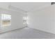 Bright bedroom with neutral carpeting and two large windows at 17347 Peregrine Way, Punta Gorda, FL 33982