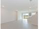 Spacious living room with open floor plan and access to the backyard at 17347 Peregrine Way, Punta Gorda, FL 33982