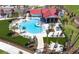 Community pool with clubhouse and lounge area at 17347 Peregrine Way, Punta Gorda, FL 33982