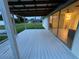 Spacious back deck overlooks a large backyard with lush green grass at 4469 Cunningham St, Port Charlotte, FL 33948