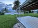 Relaxing backyard with a covered deck and a shed at 4469 Cunningham St, Port Charlotte, FL 33948