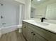 Updated bathroom with gray vanity and shower/tub combo at 4469 Cunningham St, Port Charlotte, FL 33948