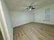 Spacious bedroom with wood-look flooring and ceiling fan at 4469 Cunningham St, Port Charlotte, FL 33948