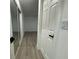 Light-filled hallway leading to a bedroom at 4469 Cunningham St, Port Charlotte, FL 33948