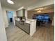 Modern kitchen with gray cabinets, quartz countertops, and stainless steel sink at 4469 Cunningham St, Port Charlotte, FL 33948