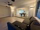 Living room with sectional sofa and view of dining area at 4469 Cunningham St, Port Charlotte, FL 33948
