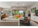 Living area with sectional sofa and access to backyard at 6043 Anvil Ave, Sarasota, FL 34243