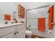 Clean bathroom with a tub shower combination and colorful decor at 6043 Anvil Ave, Sarasota, FL 34243