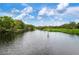Picturesque view of a canal with lush vegetation at 6043 Anvil Ave, Sarasota, FL 34243