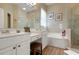 Elegant bathroom with double vanity, soaking tub and walk-in shower at 6043 Anvil Ave, Sarasota, FL 34243