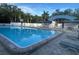 Inviting community pool with patio tables and chairs at 6043 Anvil Ave, Sarasota, FL 34243