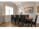 Dining room with a dark wood table and black leather chairs at 6043 Anvil Ave, Sarasota, FL 34243