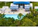 Community pool with shaded seating and lounge chairs at 6043 Anvil Ave, Sarasota, FL 34243