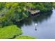 Wooden dock on the lake with a no-wake zone sign at 6043 Anvil Ave, Sarasota, FL 34243
