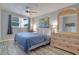 Spacious main bedroom with king-size bed and large dresser at 7329 Royal Palm Dr, New Port Richey, FL 34652