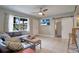 Living room with sectional sofa and tiled floors at 7329 Royal Palm Dr, New Port Richey, FL 34652