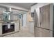 Stainless steel appliances and white shaker cabinets in this updated kitchen at 7329 Royal Palm Dr, New Port Richey, FL 34652