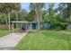 Charming bungalow with carport and manicured lawn at 7329 Royal Palm Dr, New Port Richey, FL 34652