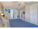 Spacious bedroom with large bed, TV, and ample closet space at 7329 Royal Palm Dr, New Port Richey, FL 34652