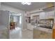 Modern kitchen with white cabinets and stone backsplash at 7329 Royal Palm Dr, New Port Richey, FL 34652