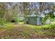 Spacious backyard with a shed and plenty of room for outdoor activities at 7329 Royal Palm Dr, New Port Richey, FL 34652