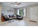 Living room with sectional sofa and tiled floors at 7329 Royal Palm Dr, New Port Richey, FL 34652