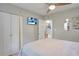 Bedroom with a post bed, TV, and built-in closet at 7329 Royal Palm Dr, New Port Richey, FL 34652
