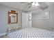 Main bedroom with a dresser and large mirror, offering ample space and natural light at 7329 Royal Palm Dr, New Port Richey, FL 34652