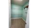 Walk-in closet featuring tile flooring and custom wire shelving for ample storage at 2633 Daisy Dr, North Port, FL 34289