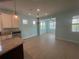 Open-concept dining area with lots of natural light, and views of the kitchen at 2633 Daisy Dr, North Port, FL 34289