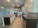 Large kitchen with stainless steel appliances, and granite countertops at 2633 Daisy Dr, North Port, FL 34289