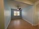 Cozy dining or living room with natural light, a ceiling fan, and tile floors at 2633 Daisy Dr, North Port, FL 34289