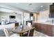 Kitchen dining area with a round table and four chairs at 4502 Banyan Tree Pl, Riverview, FL 33578