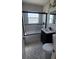 Bathroom showcasing a modern sink, a patterned floor and a glass-enclosed shower with a black frame at 3420 Ash St, Punta Gorda, FL 33950
