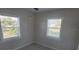 Bright bedroom featuring two windows with blinds offering lots of natural light at 3420 Ash St, Punta Gorda, FL 33950